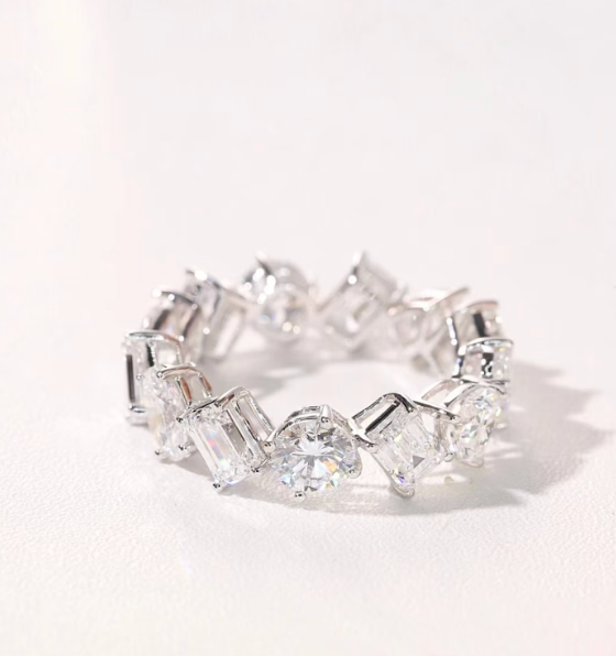 A fancy cut diamond eternity ring